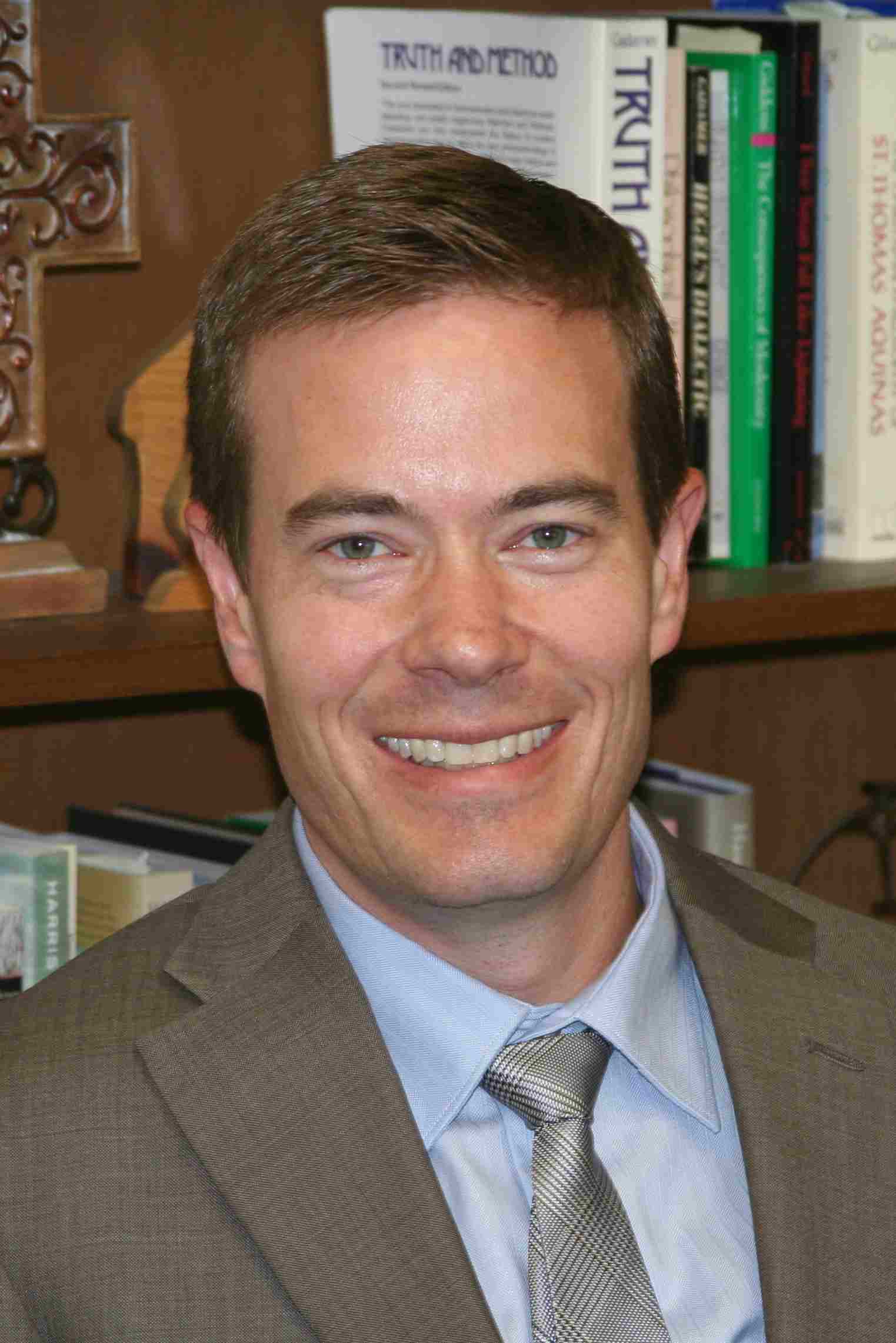Adam C. English